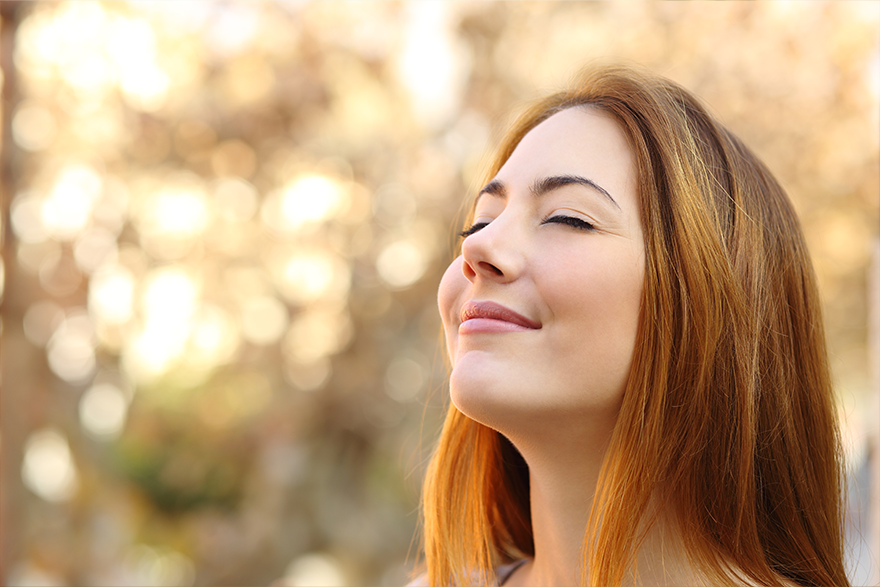 4 – White woman smiling eyes closed
