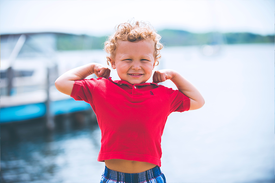 8 – little boy superhero pose unsplash